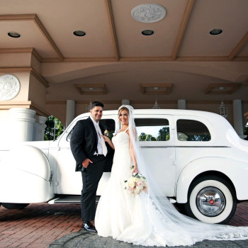 couple in front of car