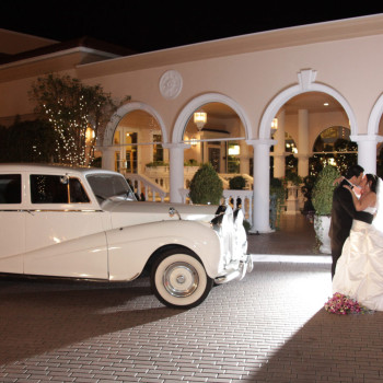 couple in front of car