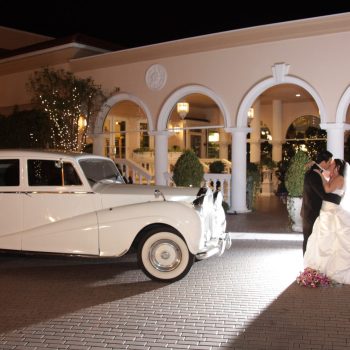 couple in front of car