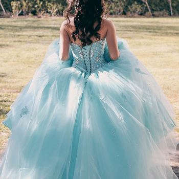 a-young-lady-dressed-in-her-fluffy-aqua-colored-pr-2021-04-05-01-17-33-utc