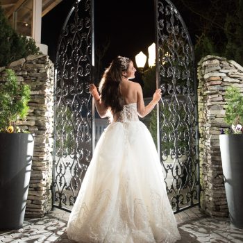 bride in front of gate