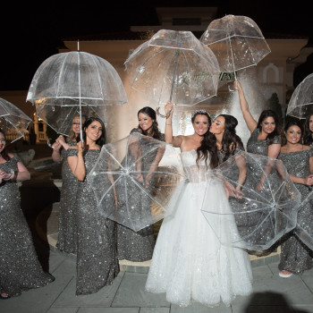 Bridal party with umbrellas