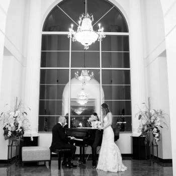 couple in front of piano